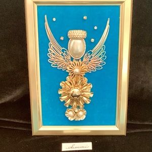 Vintage jewelry recycled, to create this one of a kind angel